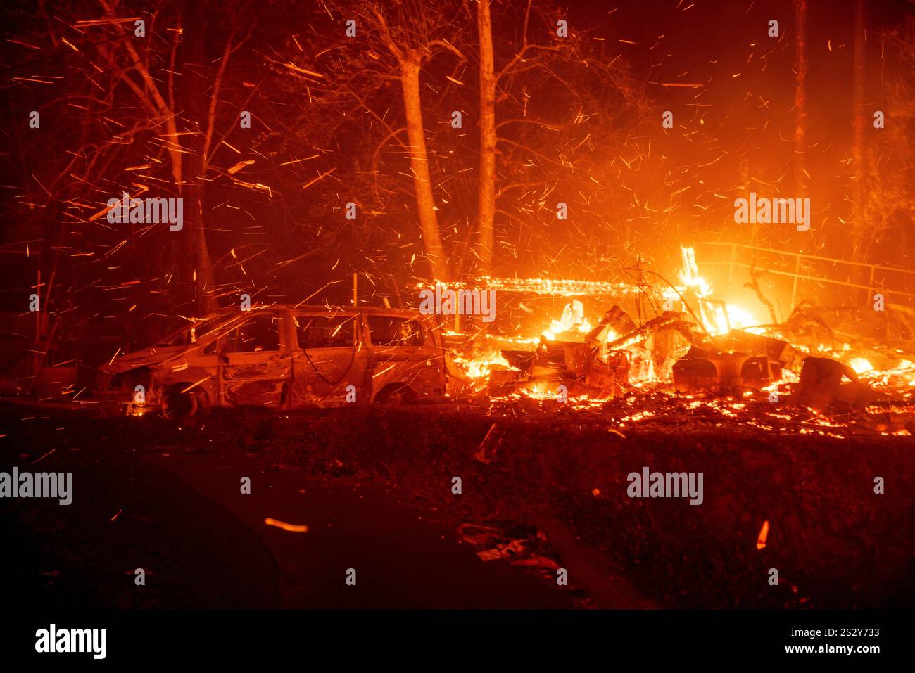 The Eaton Fire burns vehicles and structures Wednesday, Jan. 8, 2025 in