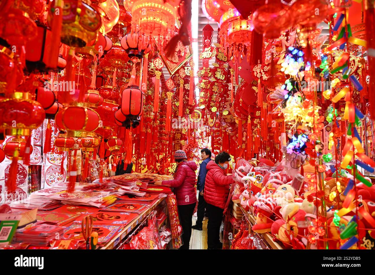 People select Spring Festival decorations at a market in Beijing, China