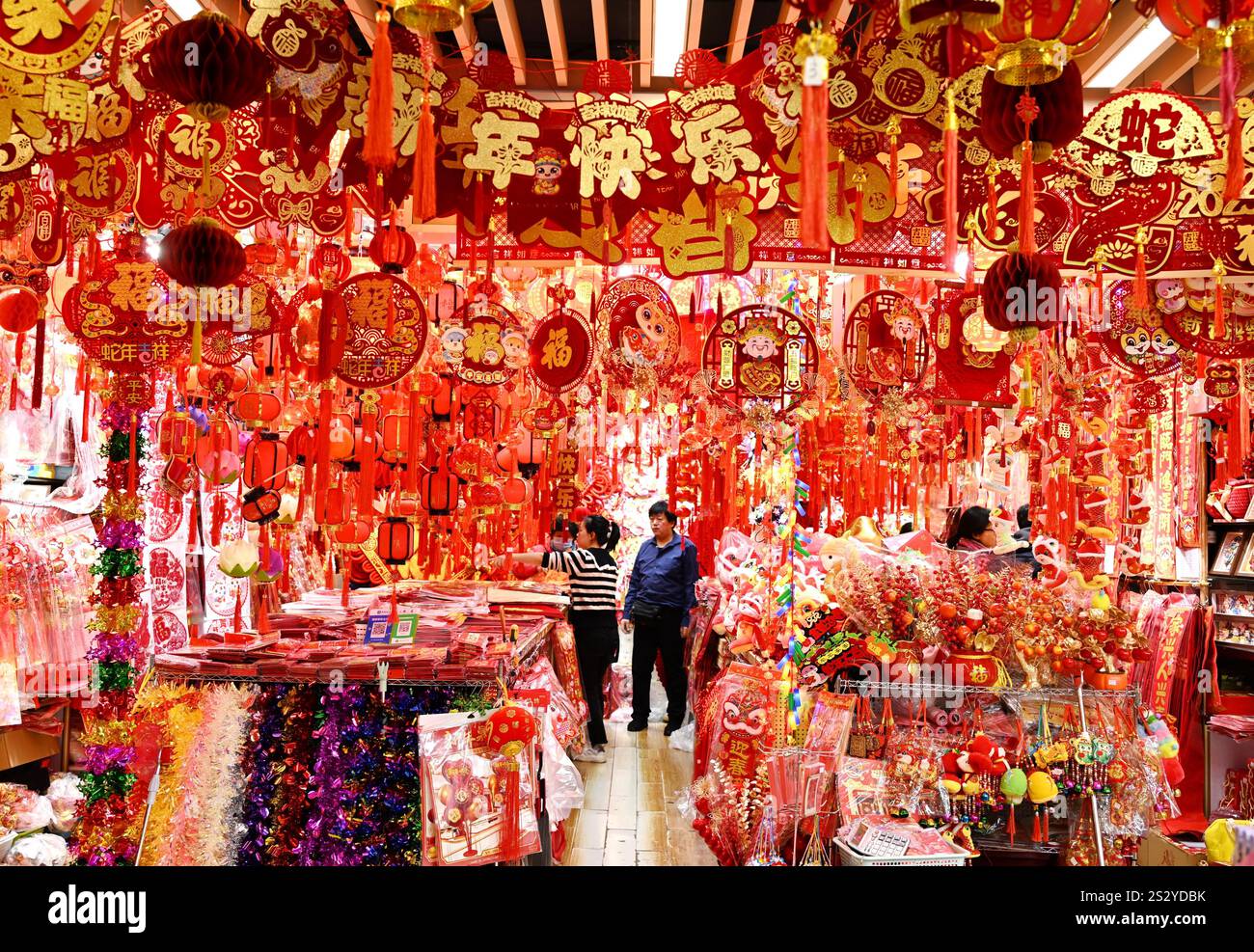 People select Spring Festival decorations at a market in Beijing, China