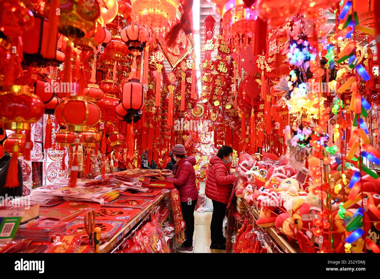 People select Spring Festival decorations at a market in Beijing, China