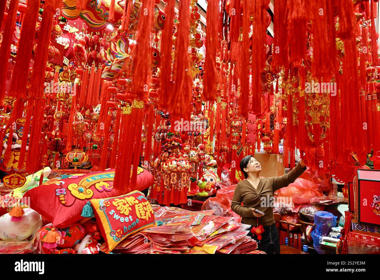 People select Spring Festival decorations at a market in Beijing, China
