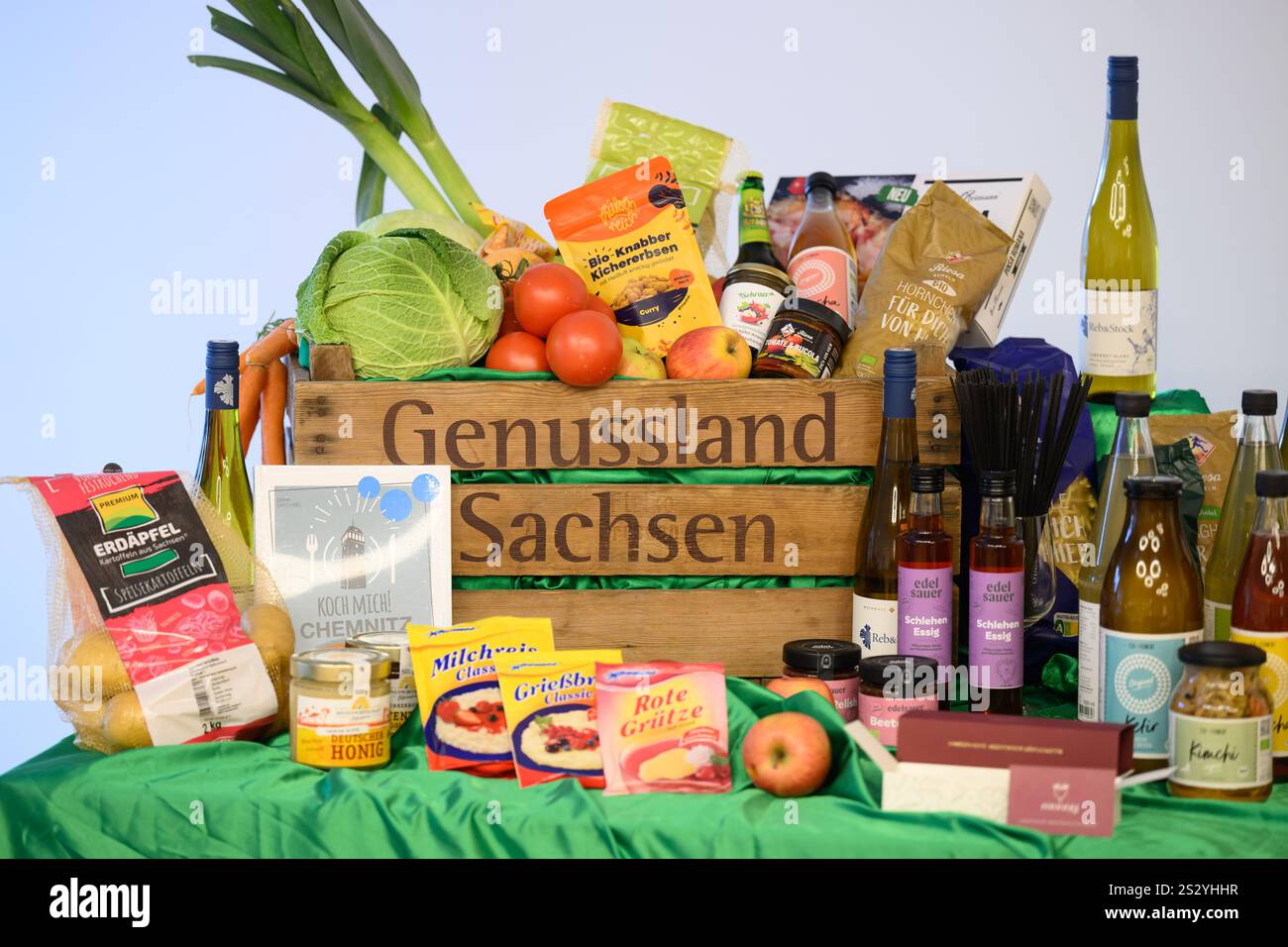 Dresden, Germany. 08th Jan, 2025. A basket of Saxon products stands on a table at Emil Reimann GmbH as part of Saxony's presentation at the Green Week. Saxony will once again be extensively represented at this year's 'International Green Week' in Berlin, giving the Saxon food industry the opportunity to present itself. This year's Green Week will take place from January 17 to 26. Credit: Robert Michael/dpa/Alamy Live News Stock Photo