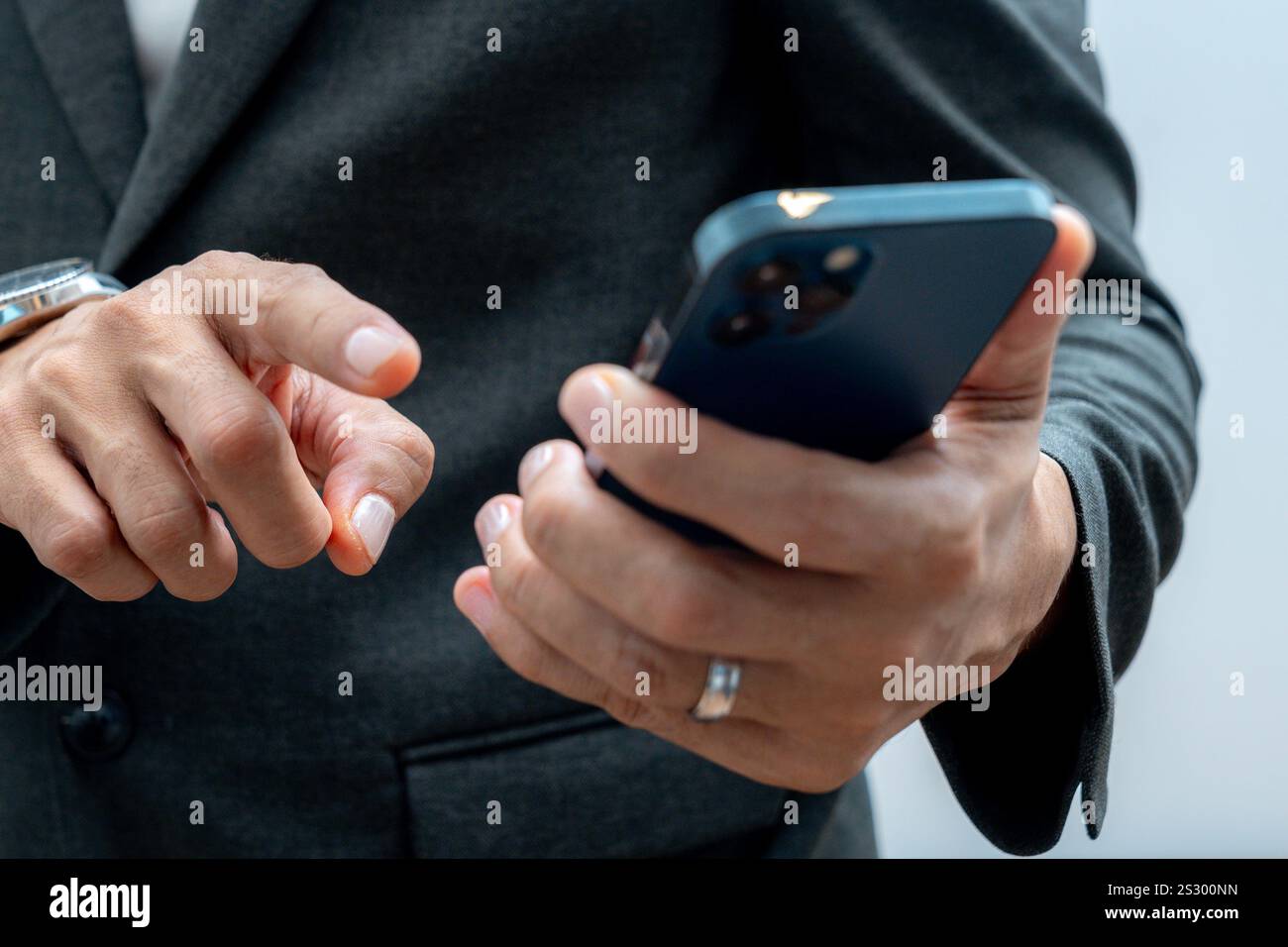 Businessman hands using smartphone for business Stock Photo