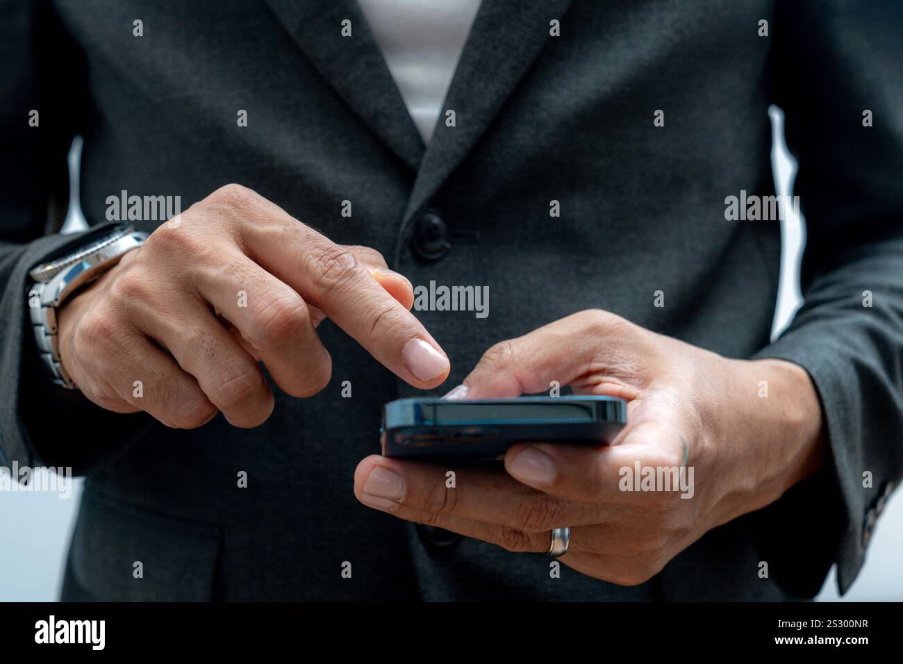Businessman hands using smartphone for business Stock Photo