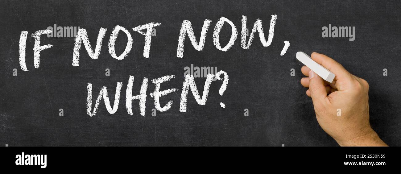 Text written on a blackboard -  If not now, when Stock Photo