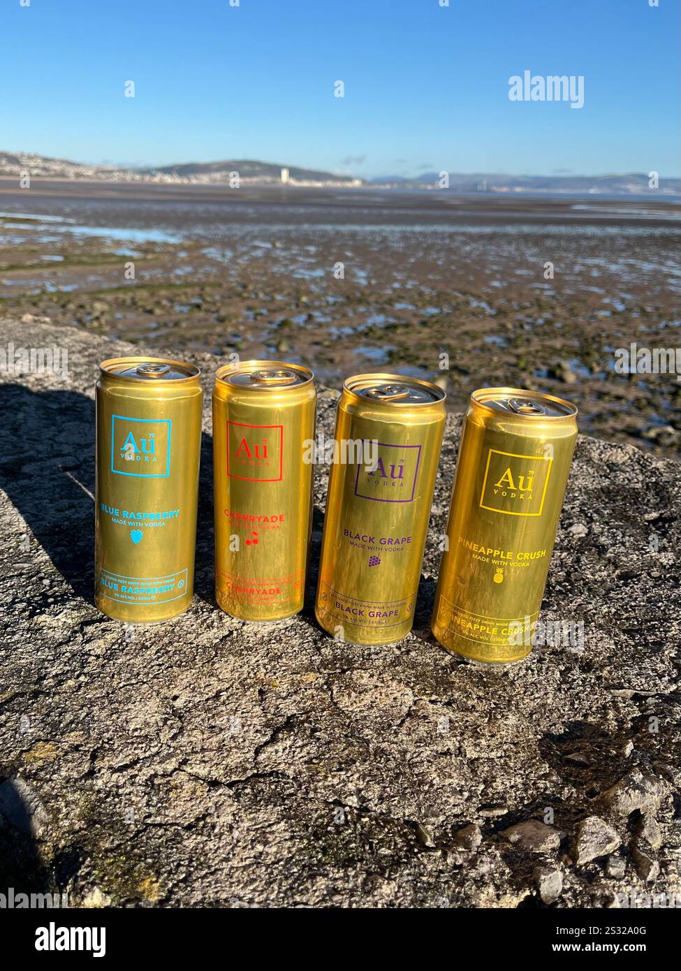 A selection of 330ml Au Vodka Pre-Mixed Cans, including Blue Raspberry, Cherryade, Black Grape, and Pineapple Crush. - Smartphone Captured Stock Image