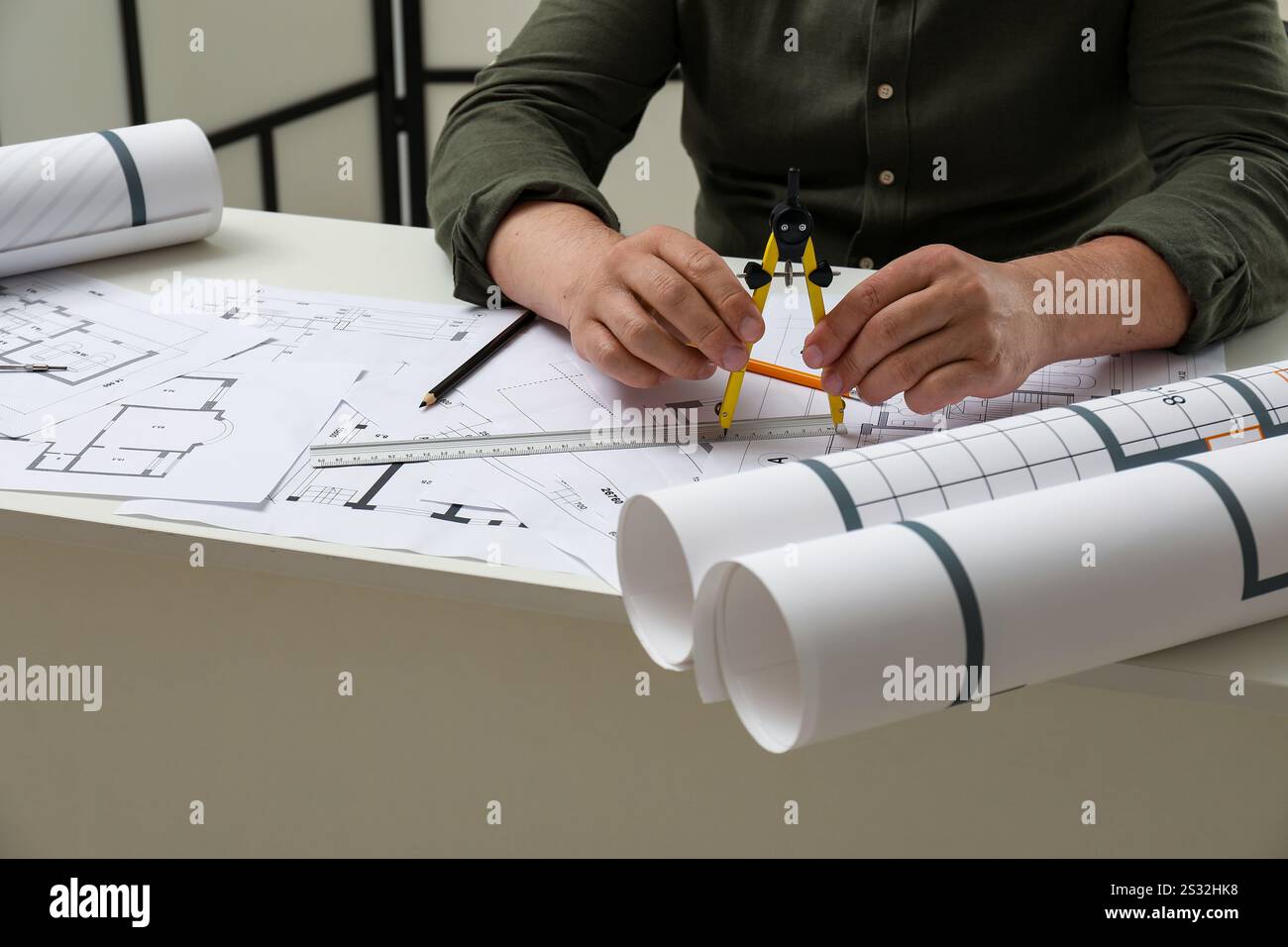Architect working with project, closeup. Different technical drawings on table Stock Photo