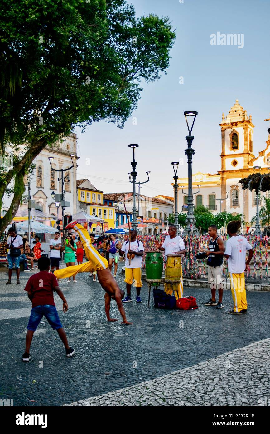 Capoeiristas perform in the Terreiro de Jesus square, Pelourinho, Salvador. Brazilian tradition, rhythm, and strength come to life. Stock Photo