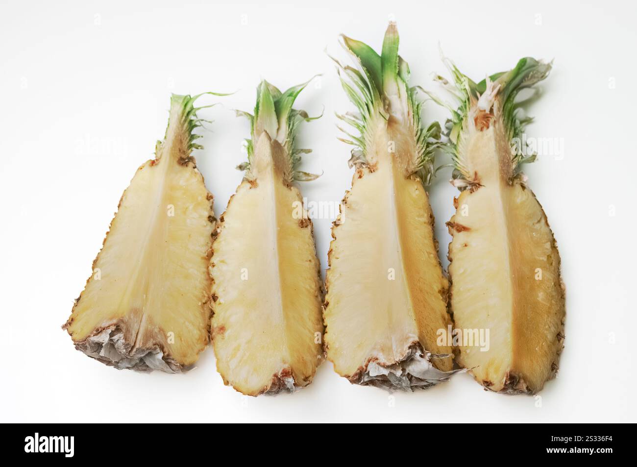A pineapple cut into pieces for consumption. Stock Photo