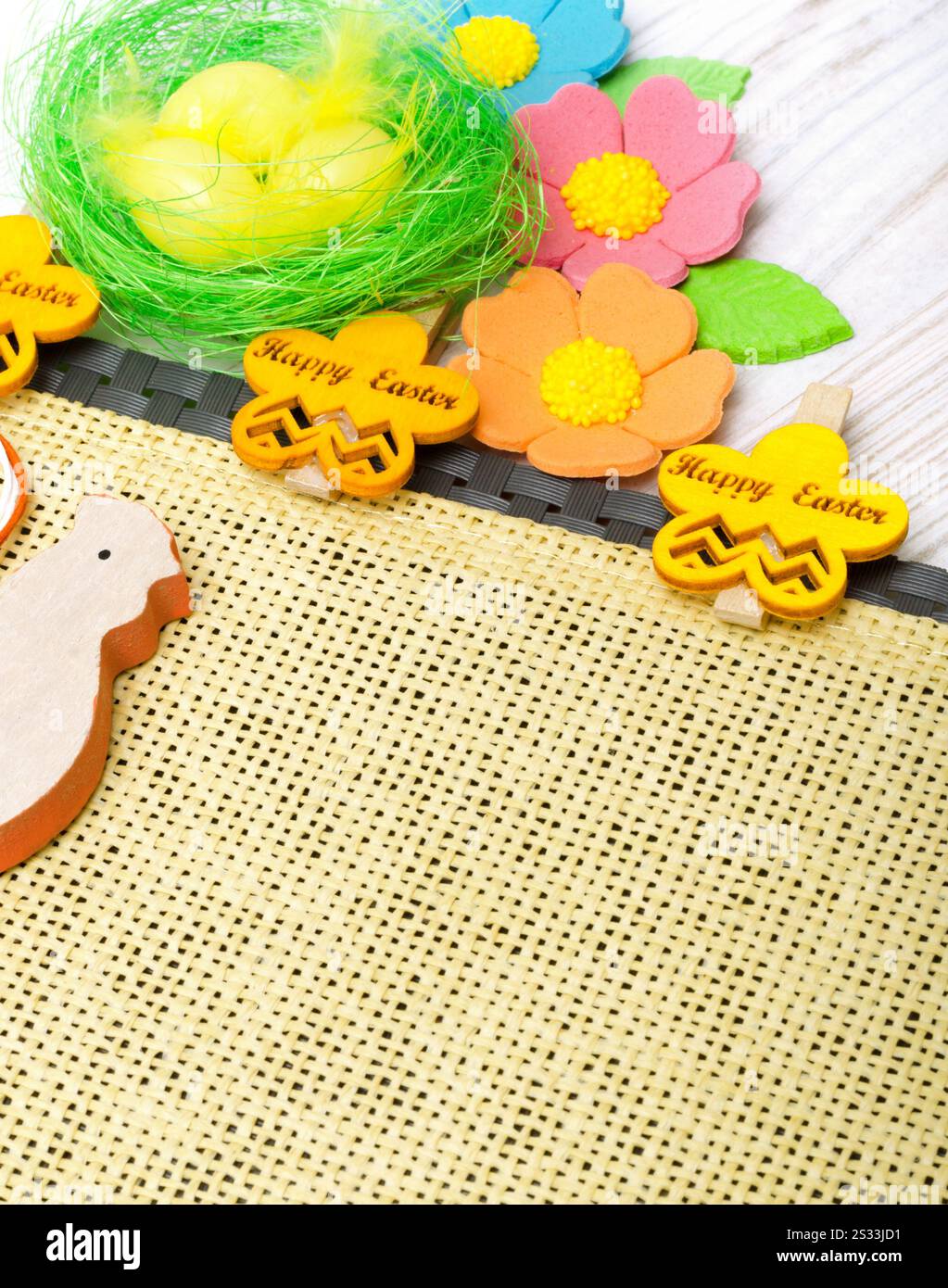 Easter eggs on a burlap background. Easter decoration. Place for text. Stock Photo