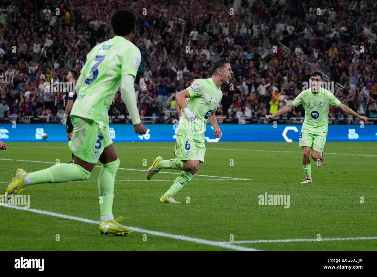 Barcelona's Gavi, center, celebrates after scoring during the Spanish