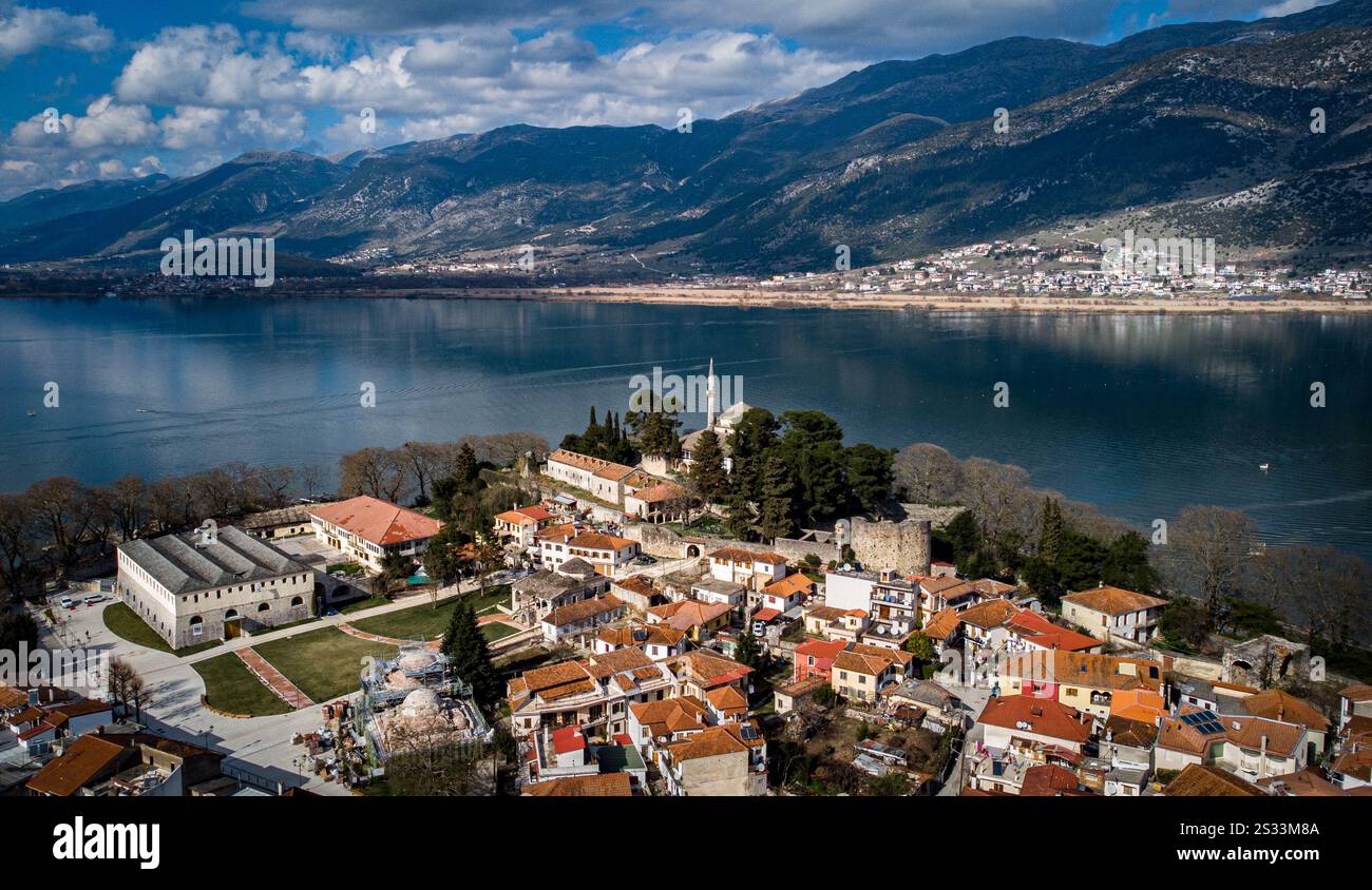 An expansive aerial view showcases a picturesque small town nestled ...
