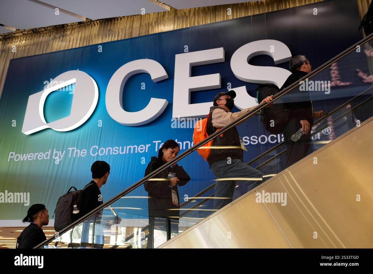 People attend the CES tech show Wednesday, Jan. 8, 2025, in Las Vegas ...