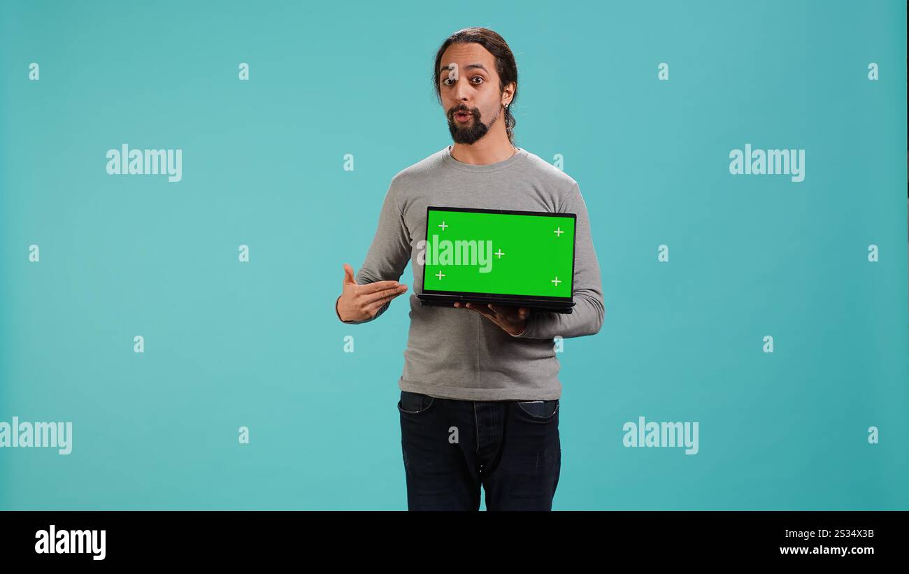 Tech content creator doing influencer marketing using green screen ...