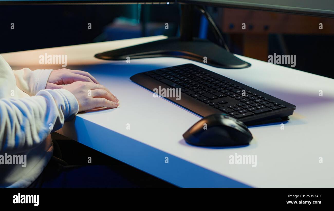 Teleworking computer technician typing on keyboard, implementing security measures to protect company systems and data, close up. Remote IT employee at home debugging code for software, camera A Stock Photo