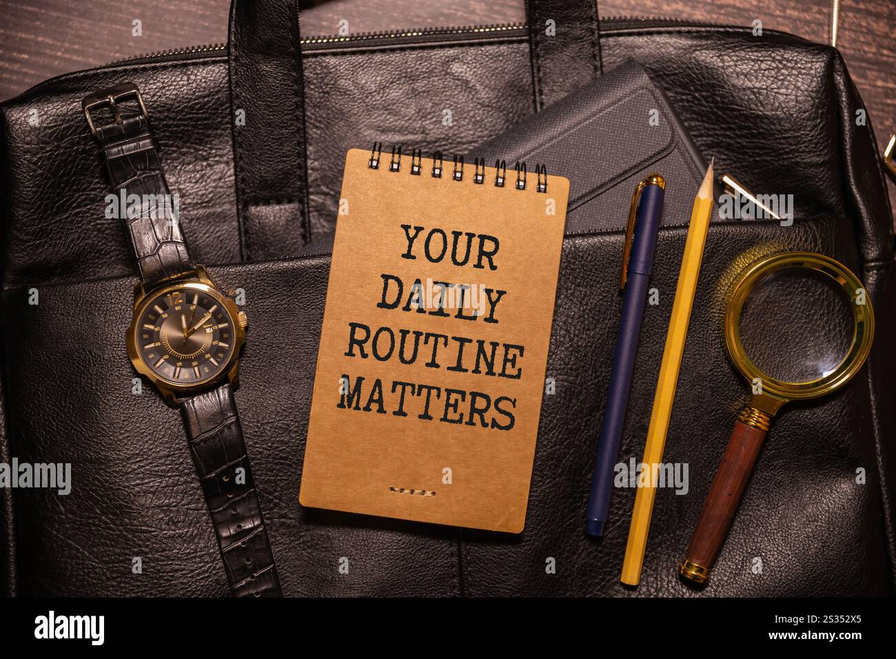 Handwriting text writing Your Daily Routine Matters on notebook. Stock Photo