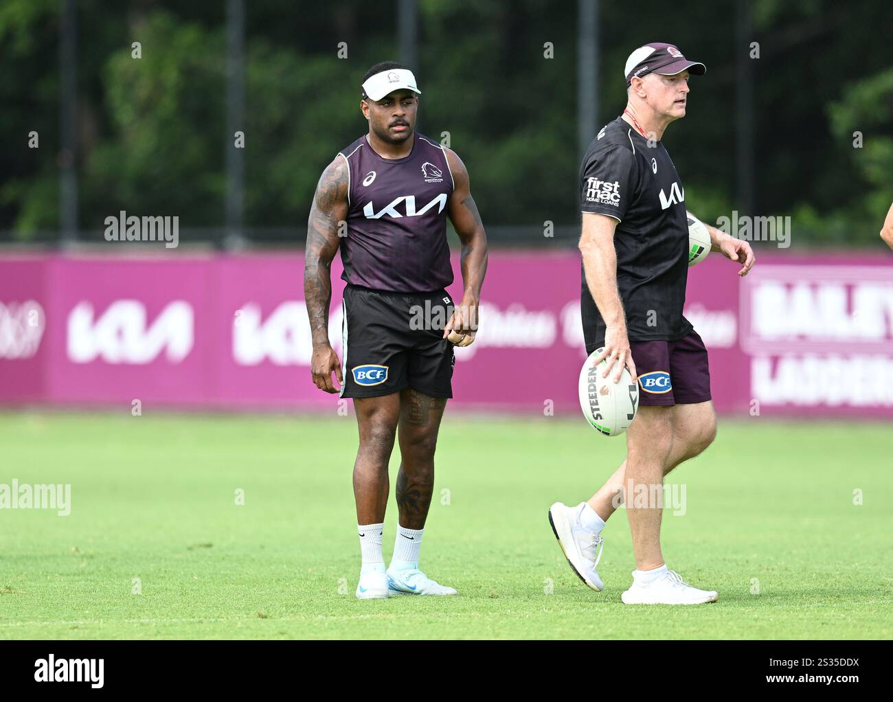Ezra Mam (left) and Broncos coach Michael Maguire (right) are seen