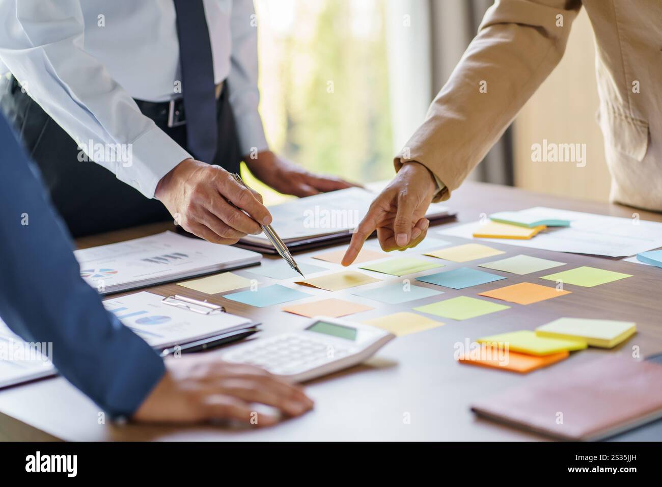 Business People brainstorming Meeting Design Ideas use post it notes to ...