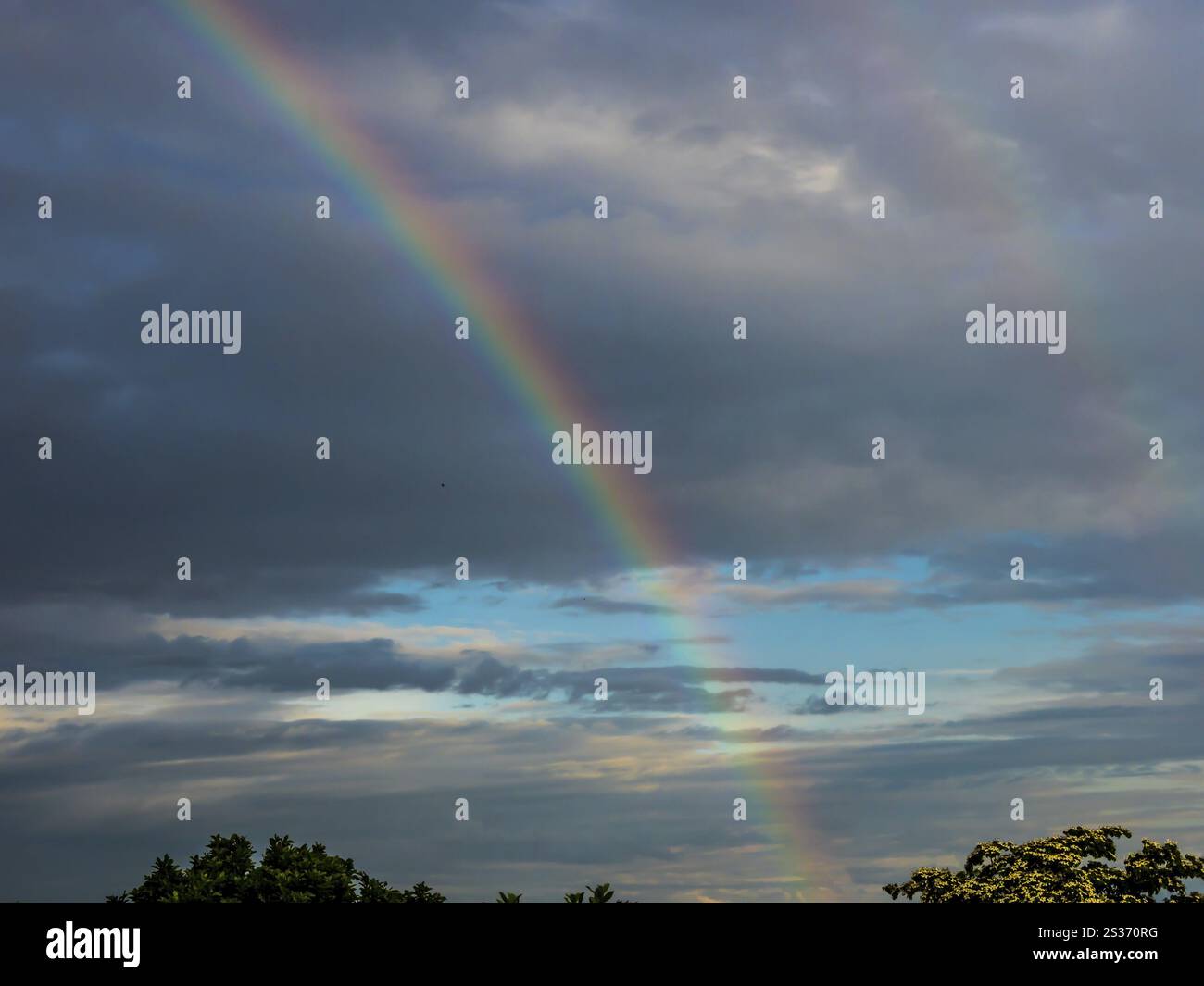 A rainbow appears in the sky after a thunderstorm Stock Photo - Alamy