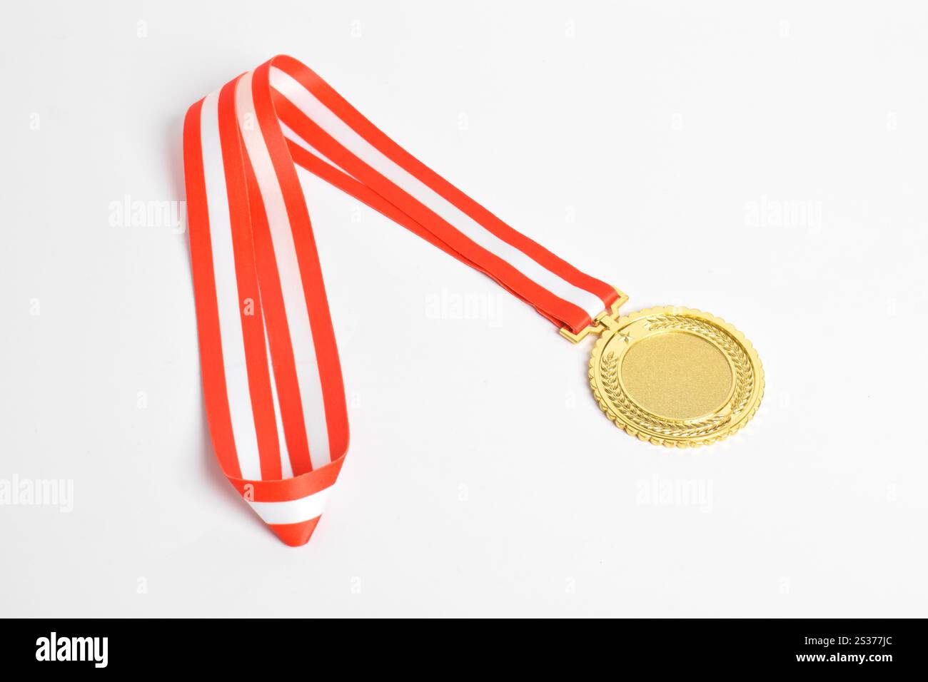 Gold medal with red and white ribbon isolated on white background ...