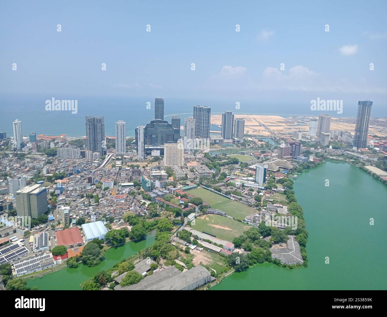 Panoramic stunning aerial view of Colombo city from Lotus Tower, showcasing skyscrapers, the coastline, and lush greenery - Smartphone Captured Stock Image