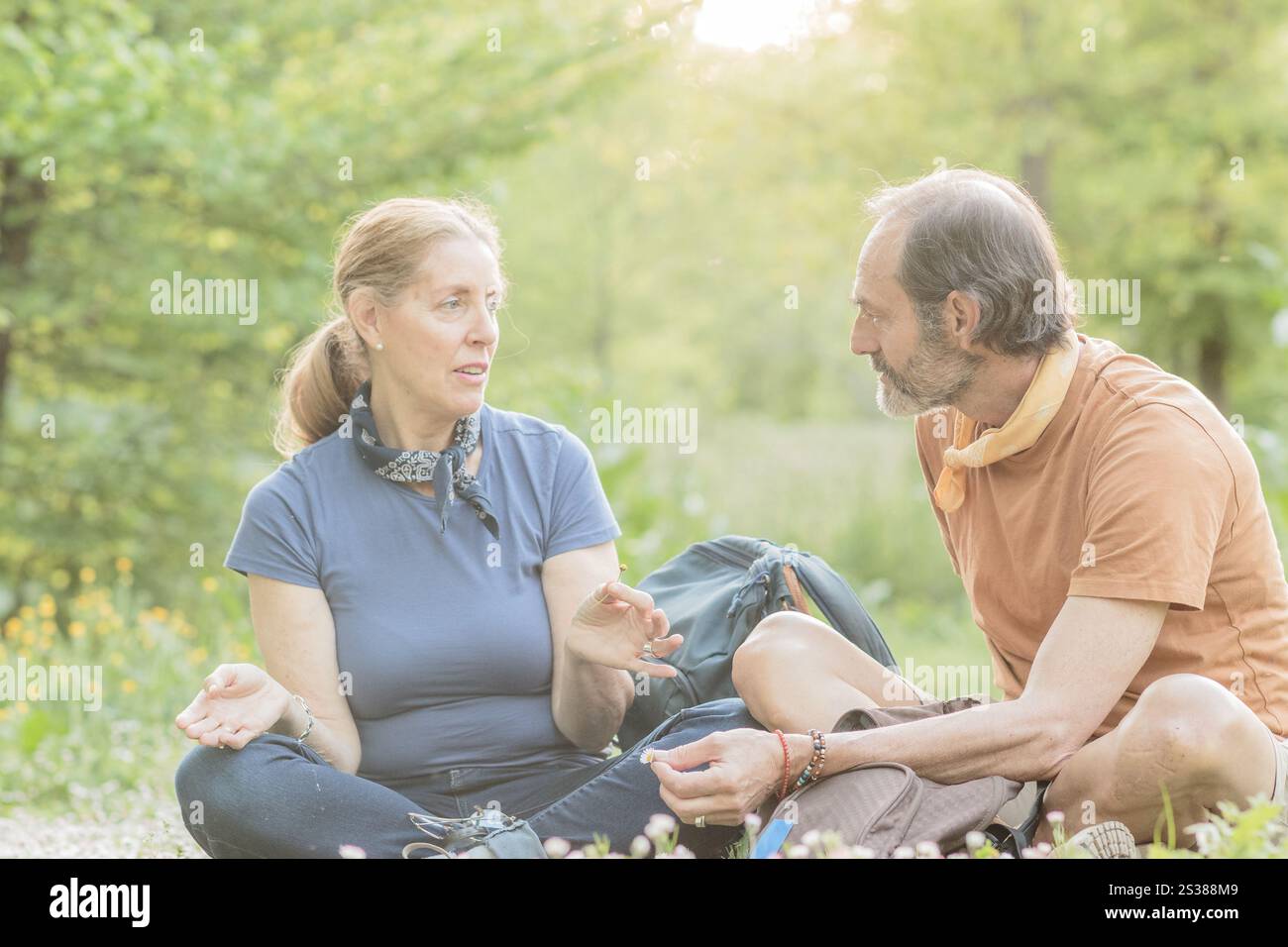 Two biologists are taking a break during their hike in a park in madrid ...