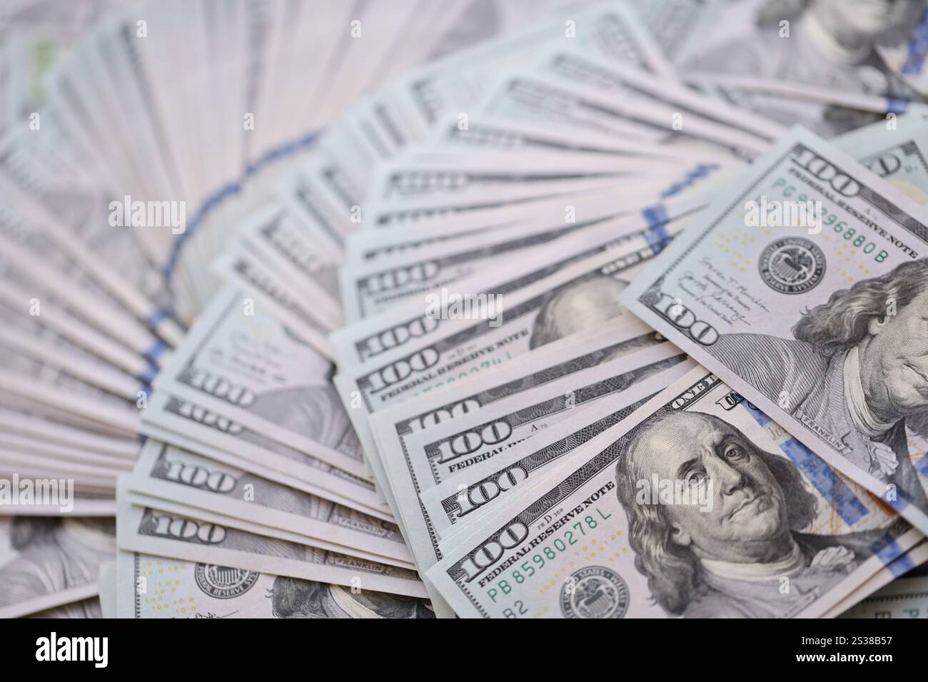 Very big amount of US hundred dollar bills close up. Huge quantity of ...