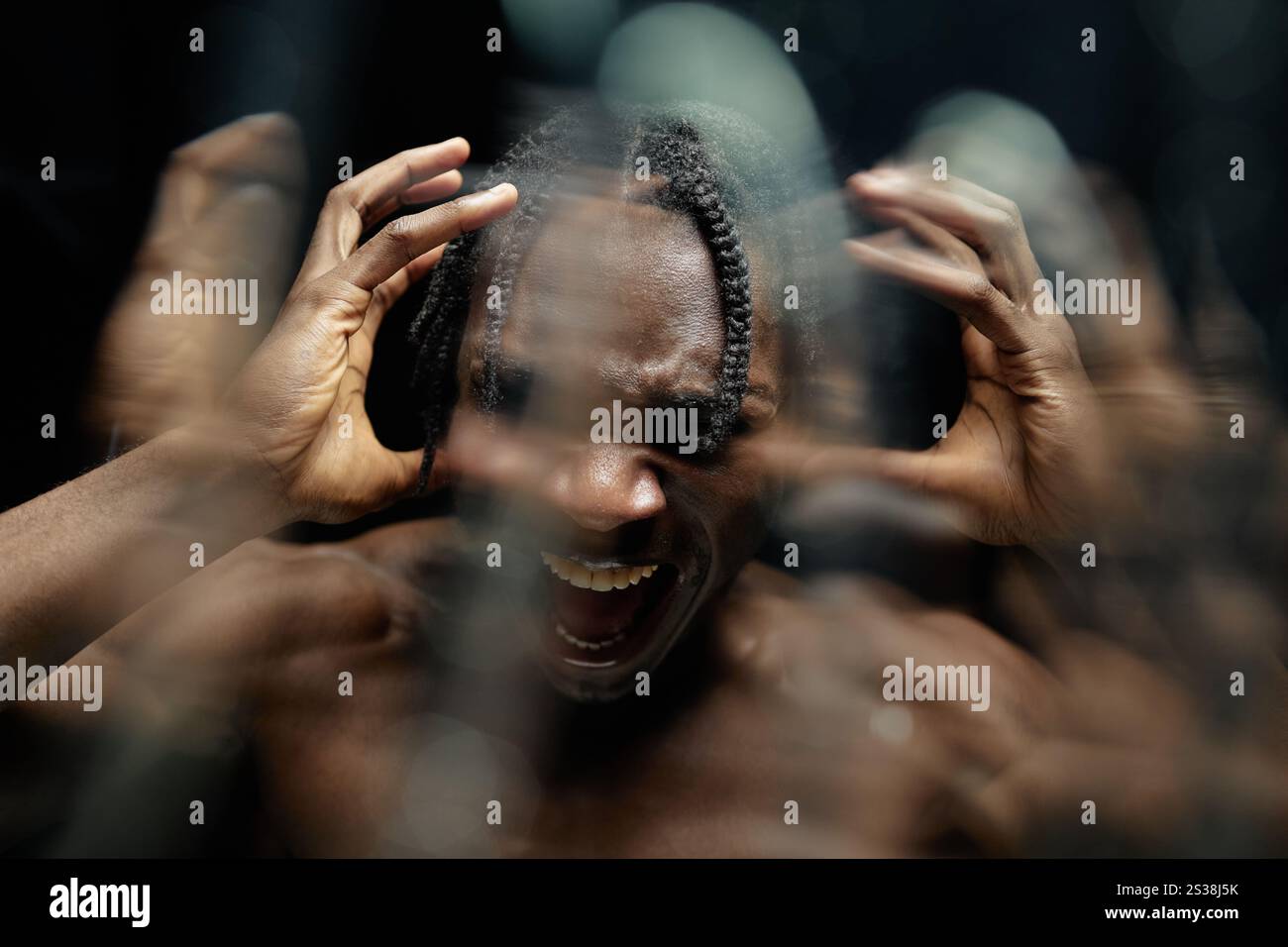 Portrait of troubled Black man fiercely shouting experiencing outburst ...