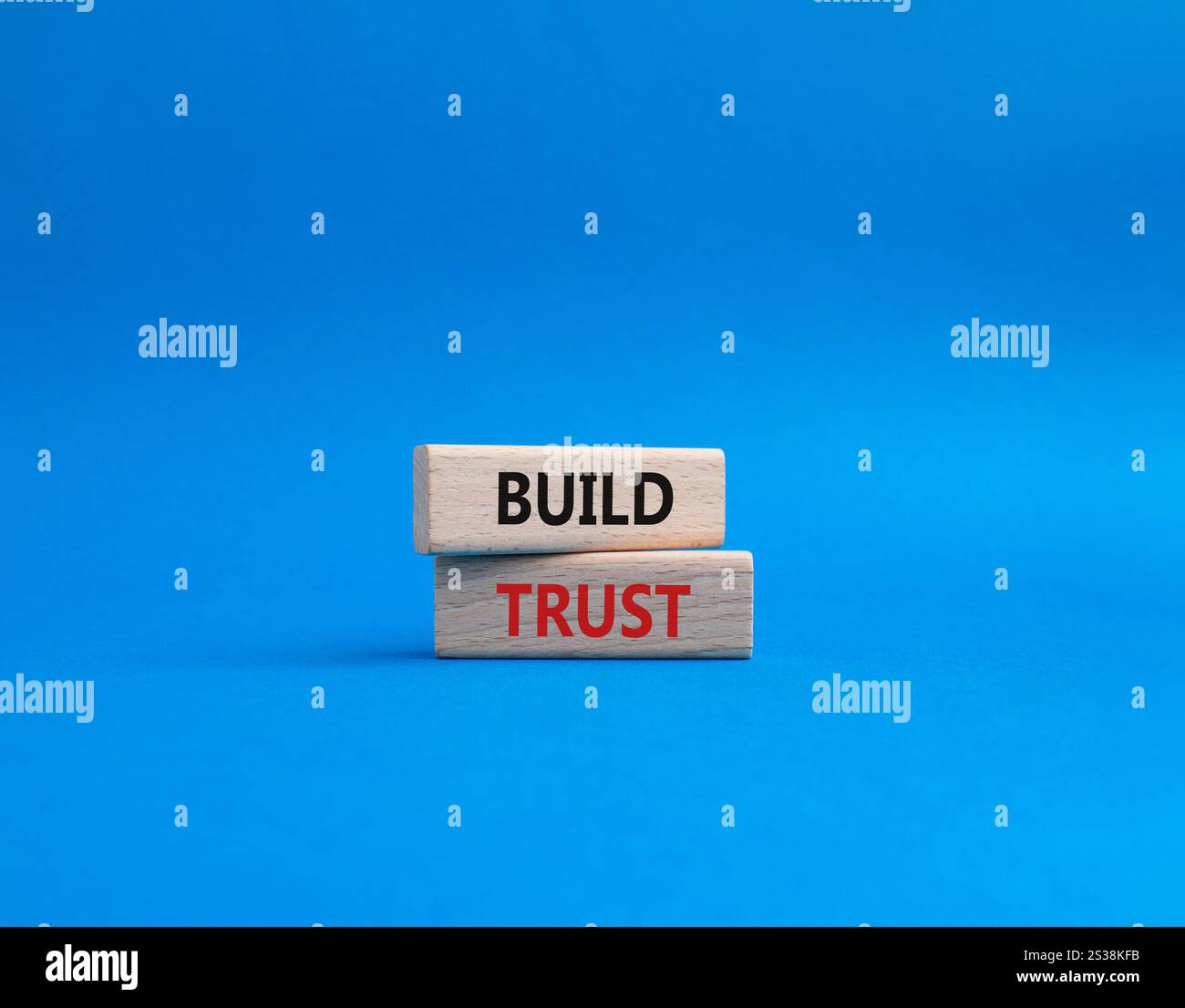Build trust symbol. Wooden blocks with words Build trust. Beautiful ...