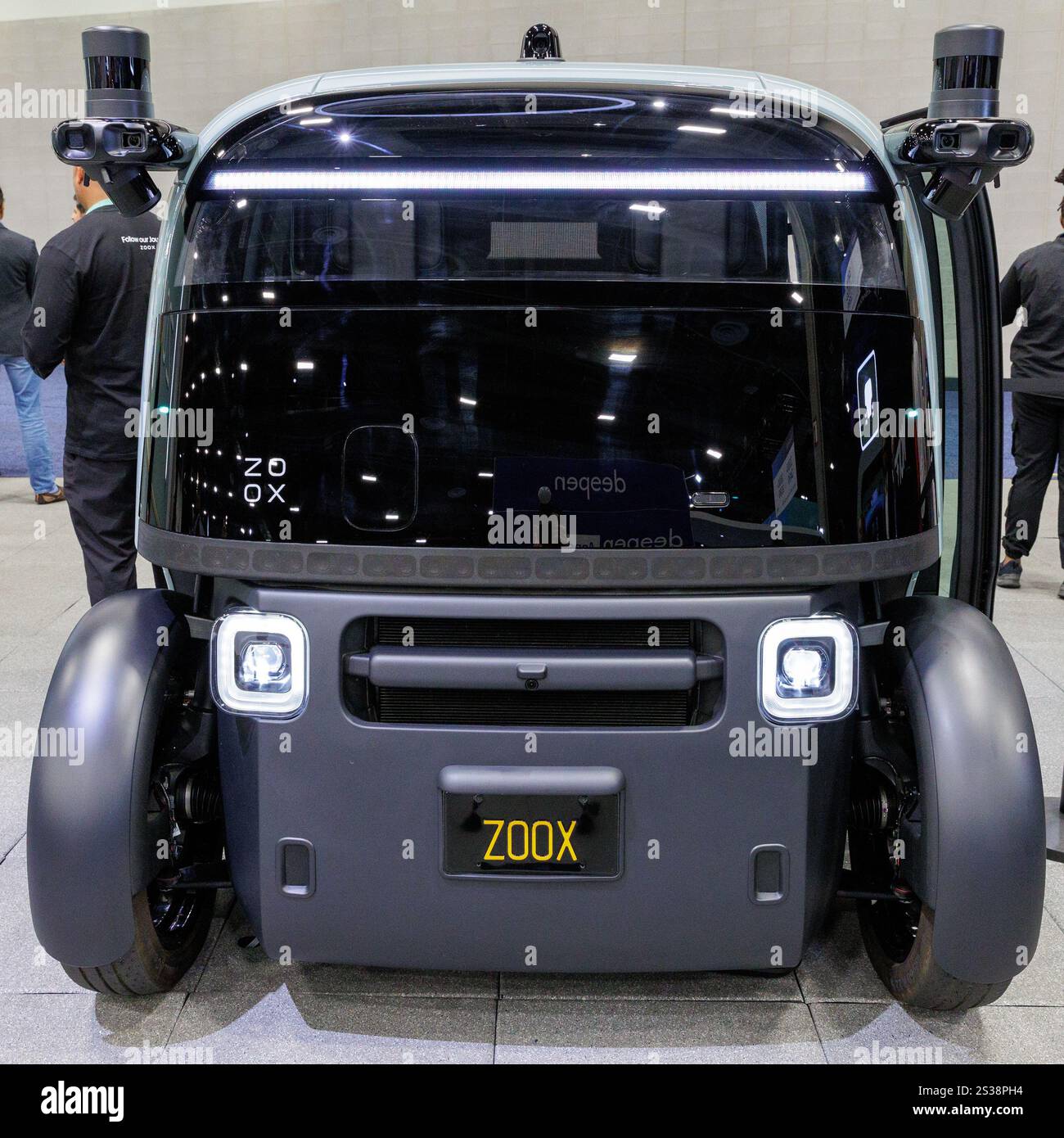 An allelectric, fully autonomous ridehail vehicle on display by Zoox