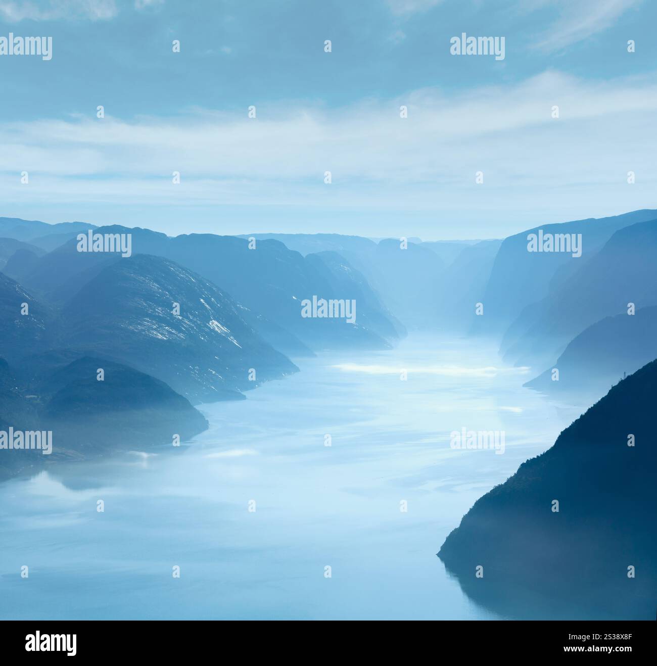 Summer morning misty view from Preikestolen massive cliff top (Norway, Lysefjorden) Stock Photo