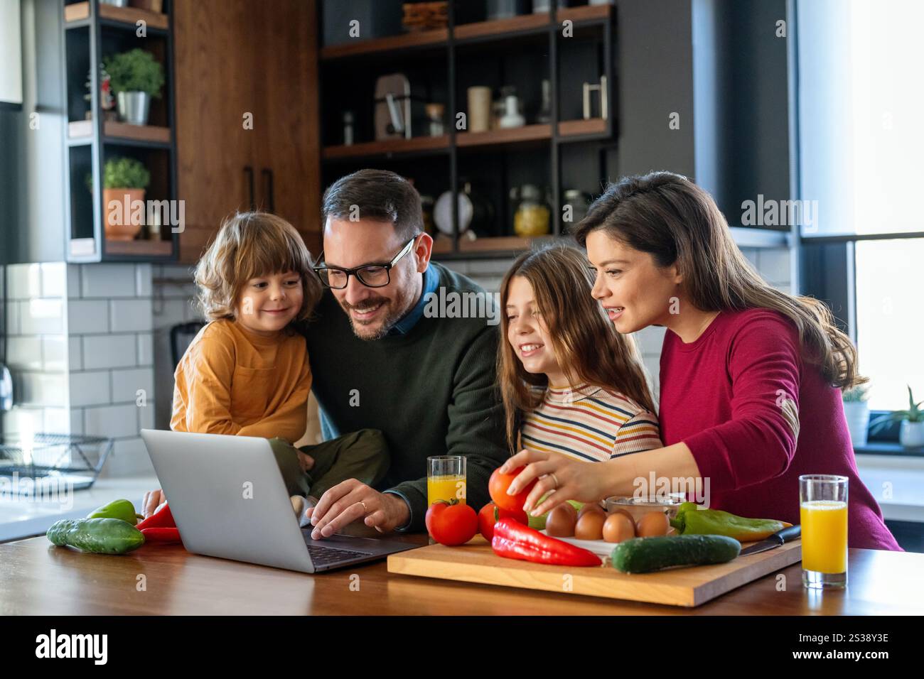 Device technology family online education concept. Happy family with ...