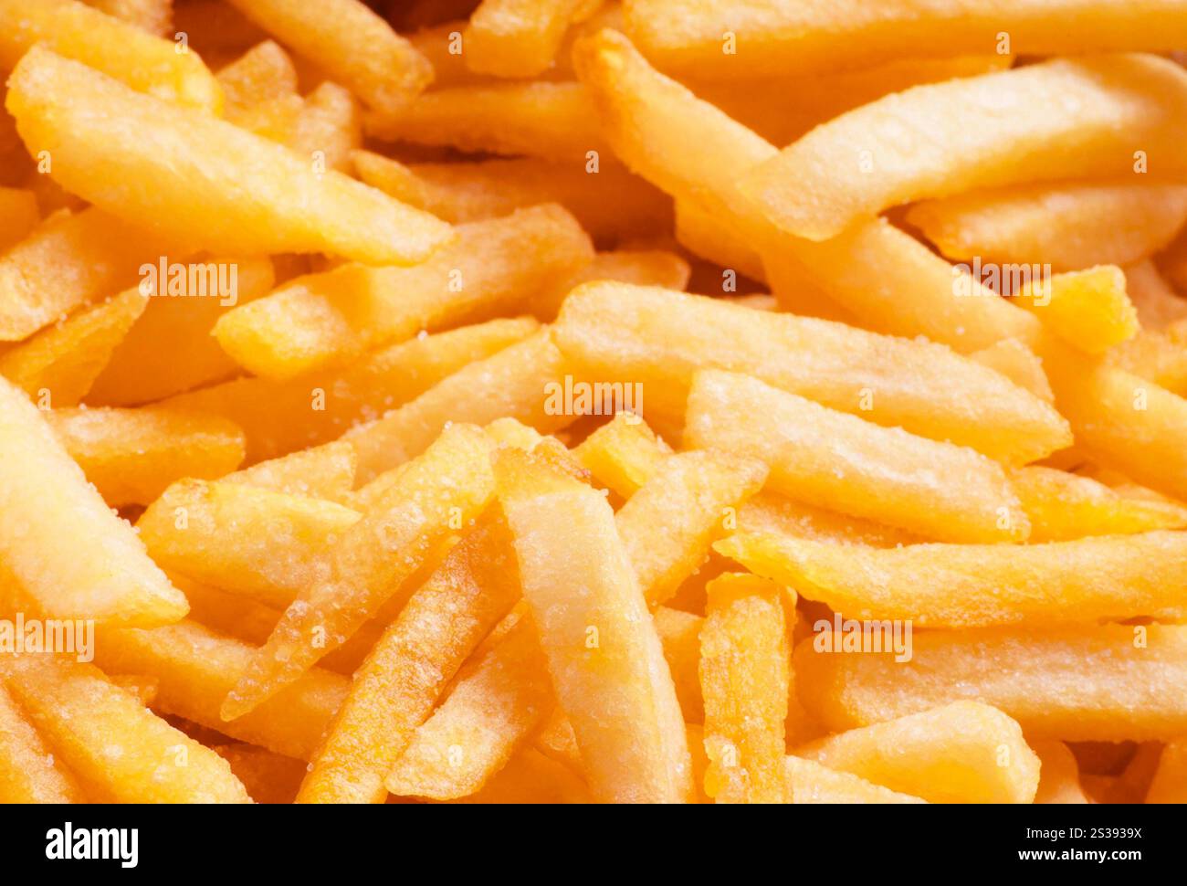 pile of golden fast food french fries close up. pile of golden fast food french fries Stock Photo