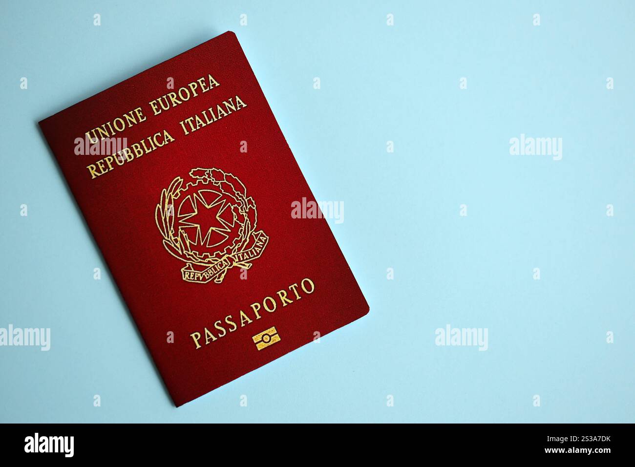 Italian passport on blue background close up. Tourism and citizenship concept. Italian passport on blue background close up Stock Photo