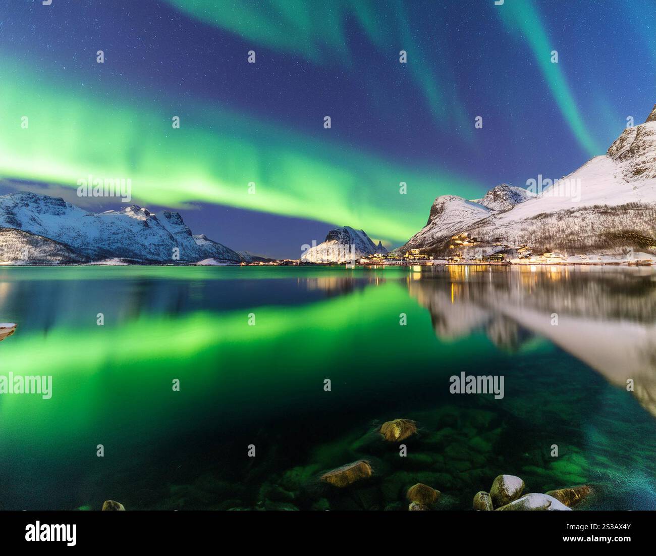 The breathtaking display of the northern lights dances across the night ...