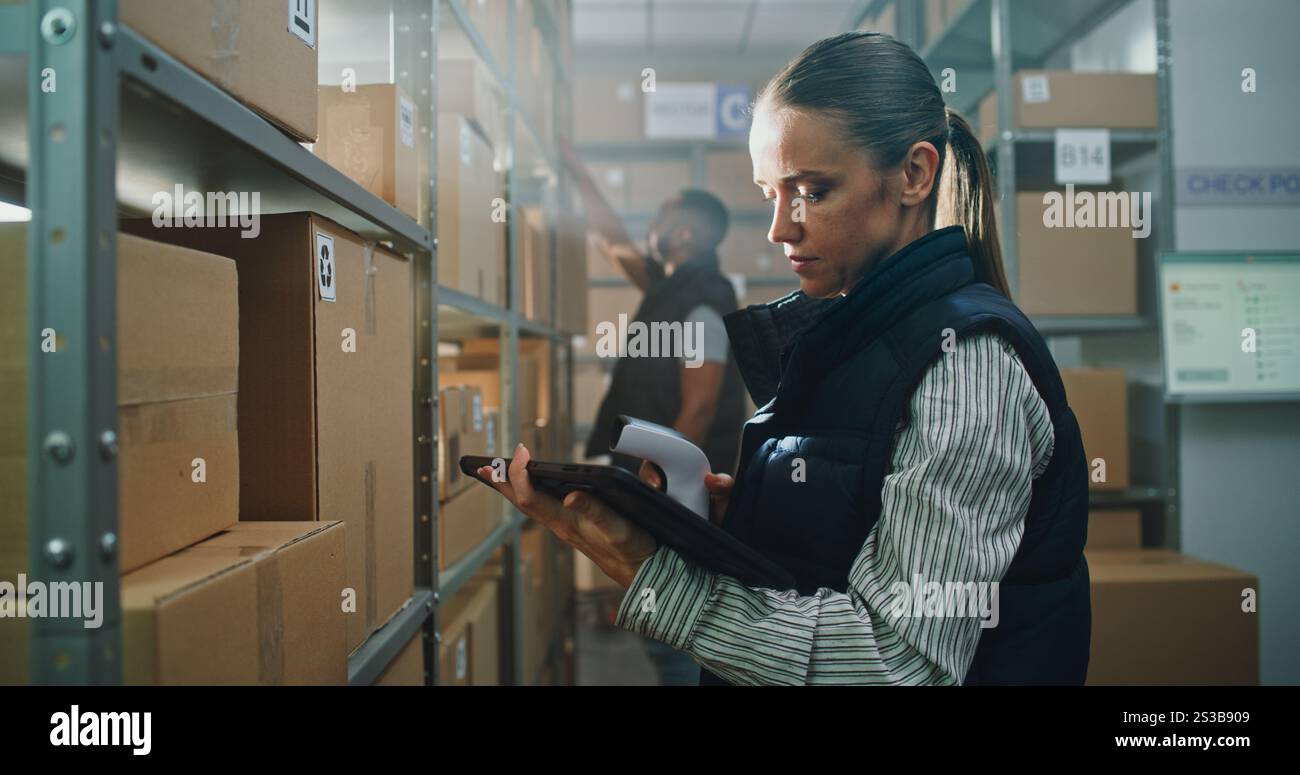 Female inventory specialist scans parcels hi-res stock photography and ...