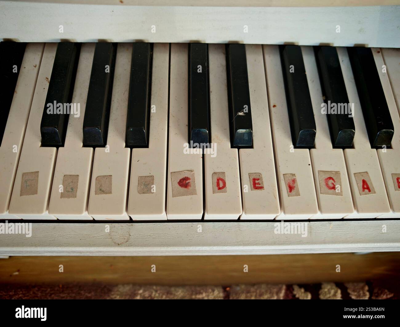 a piano, a stringed keyboard instrument for playing music pieces a ...