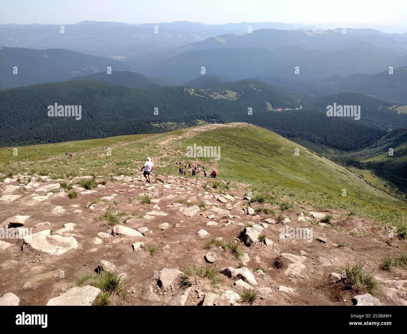 Descent from the mountain to the bottom of the path Carpathians Ukraine track trail concepts horizontal color photo image. Descent from the mountain Stock Photo