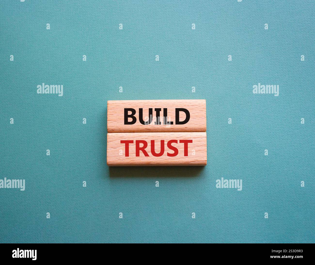 Build trust symbol. Wooden blocks with words Build trust. Beautiful ...