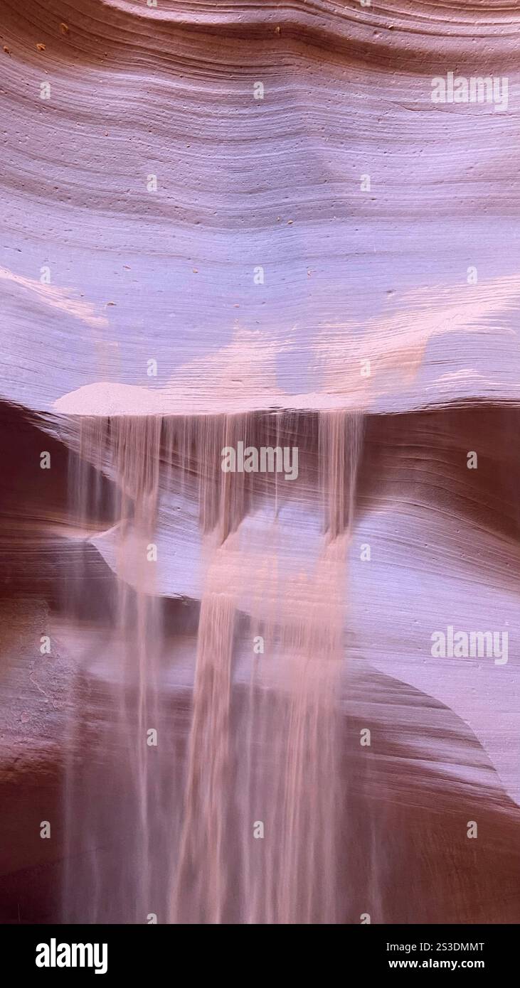 Sand flowing down a stone wall - Smartphone Captured Stock Image