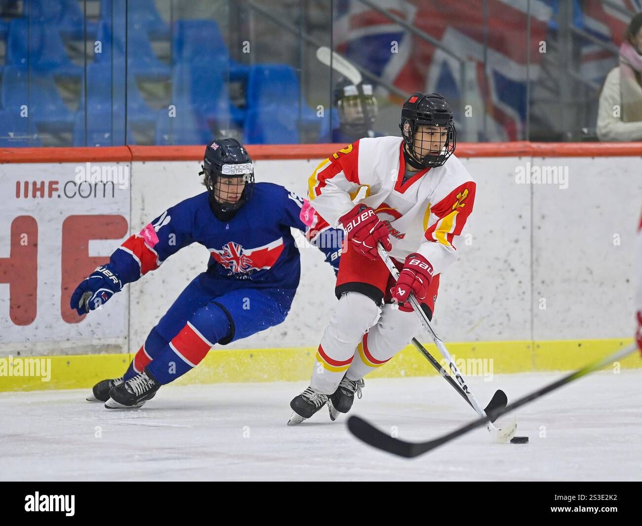 Zijian Zhou of China plays the puck during the 2025 Ice Hockey U20