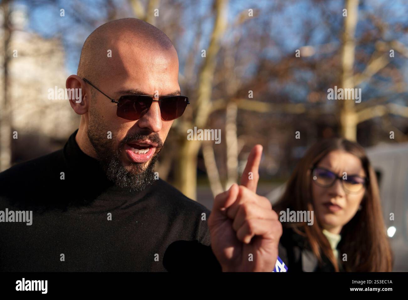 Andrew Tate gestures while speaking outside the Bucharest Tribunal in Bucharest, Romania ...