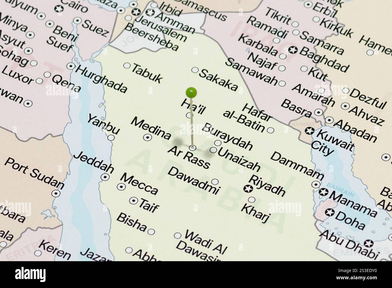 Macro photo of a green pin needle into Ar Rass city of Saudi Arabia ...