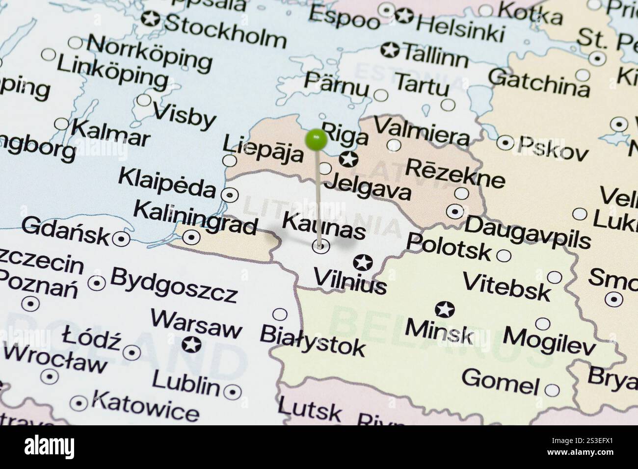 Macro photo of a green pin needle into Kaunas city of Lithuania ...