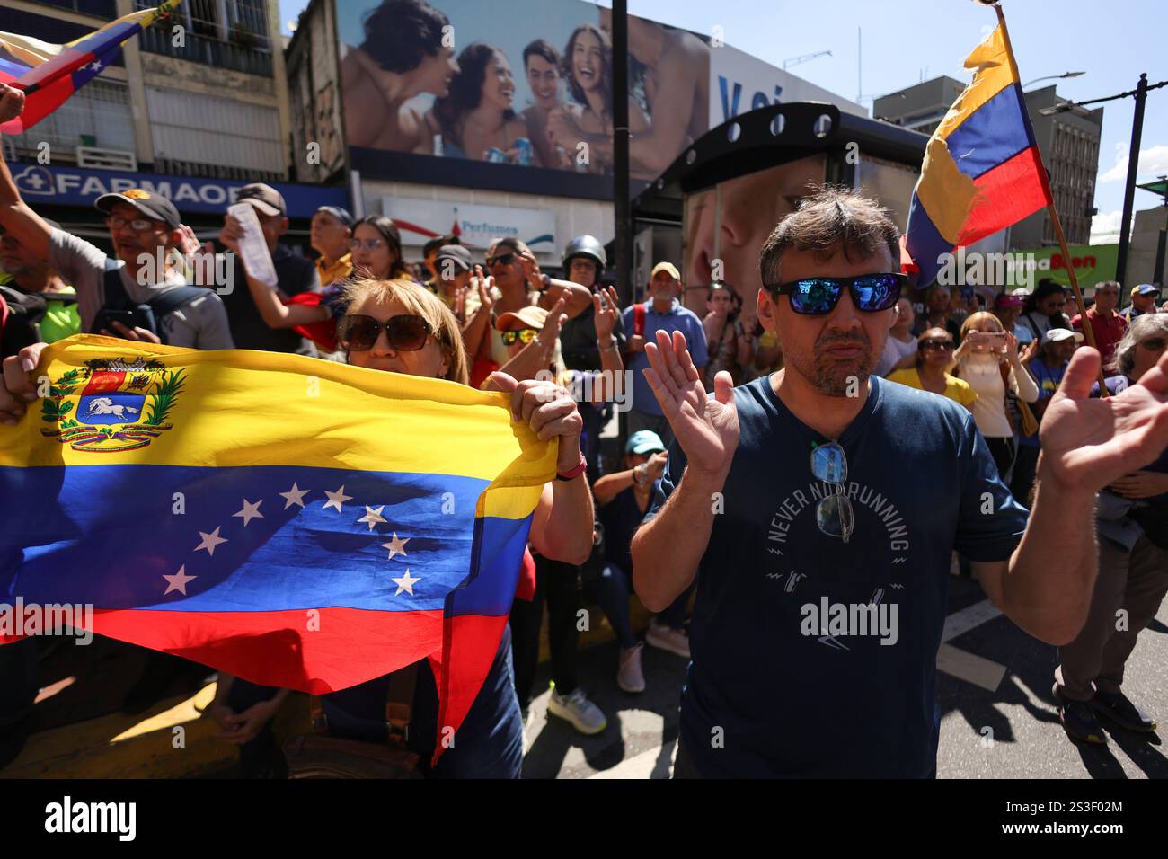 09 January 2025, Venezuela, Caracas Demonstrators wave Venezuelan
