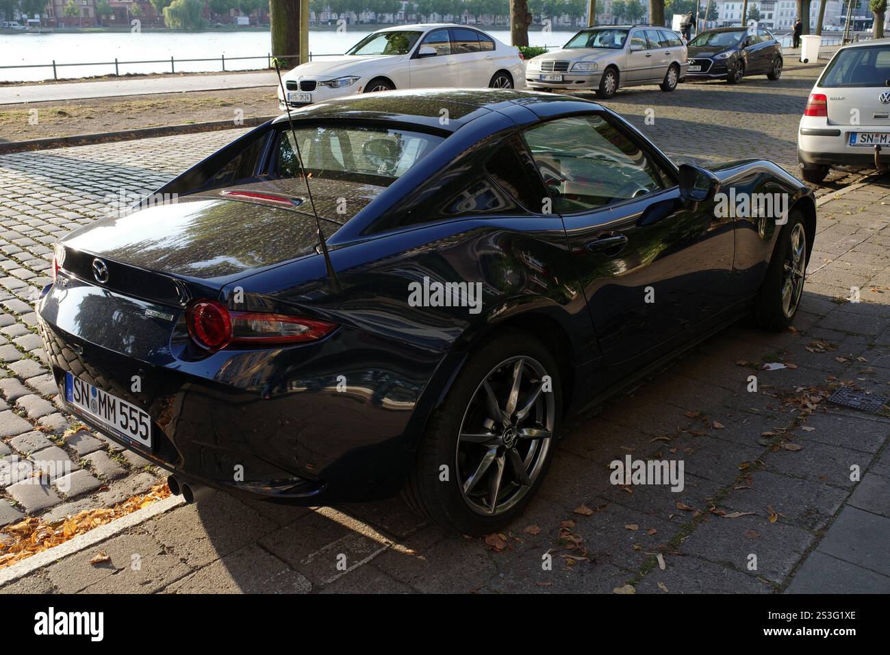 Schwerin, Germany Aug 26 2024 The back side of a very dark blue Mazda MX5 skyactive G Stock Photo