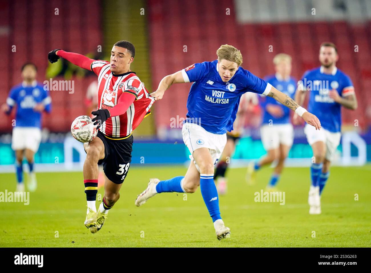 Sheffield United's Ryan One (left) and Cardiff City's Jesper Daland