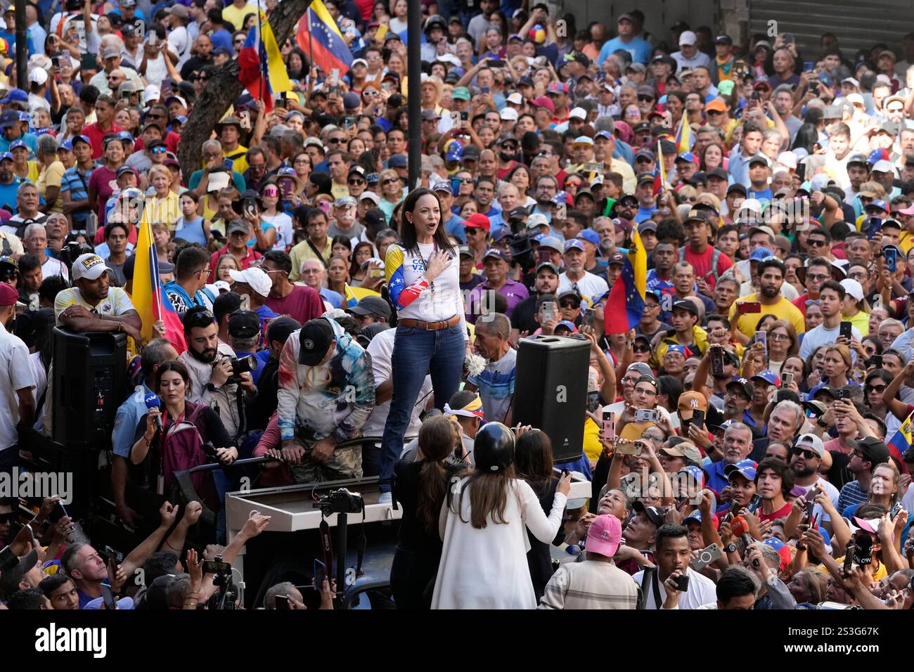 Opposition leader Maria Corina Machado stands before supporters during