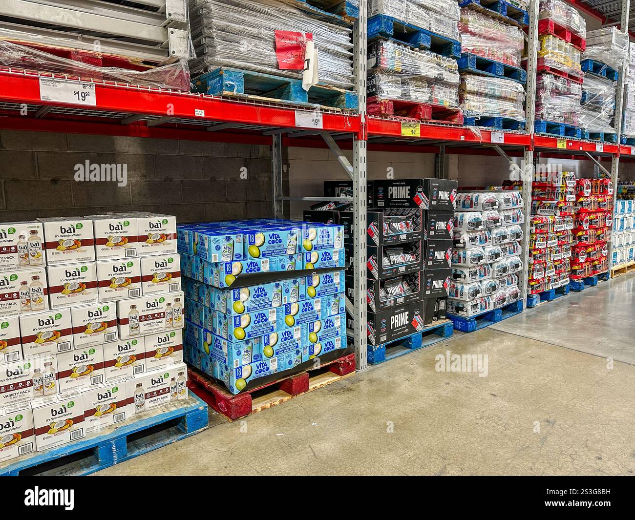 Pallets of bottled drinks for sale at a Sam's Club wholesale store - Smartphone Captured Stock Image