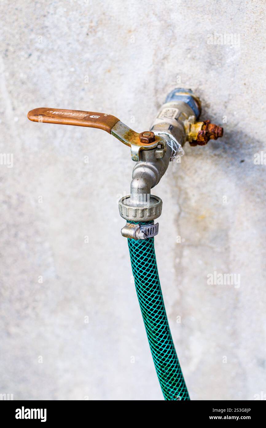 Water tap on the wall Stock Photo